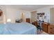Comfortable bedroom setup with a bed, workspace desk, and adjacent bathroom at 2113 Barksdale St, Port Charlotte, FL 33948