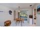 Bright dining area with a table and sliding glass doors leading to the outdoors at 2113 Barksdale St, Port Charlotte, FL 33948