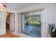 Dining area with sliding glass doors to a sunroom, bringing in lots of natural light at 2113 Barksdale St, Port Charlotte, FL 33948