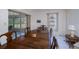 Dining room with a large wooden table and access to a screened in porch at 2113 Barksdale St, Port Charlotte, FL 33948