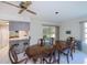 Inviting dining room area offering access to the kitchen and screened in porch at 2113 Barksdale St, Port Charlotte, FL 33948