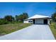 Home with a carport and a long driveway at 2113 Barksdale St, Port Charlotte, FL 33948