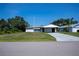 Charming single-story home featuring a carport and a concrete driveway at 2113 Barksdale St, Port Charlotte, FL 33948