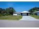 Charming single-story home featuring a carport and a concrete driveway at 2113 Barksdale St, Port Charlotte, FL 33948