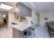 Modern kitchen featuring a breakfast bar, lots of counter space and plenty of natural light at 2113 Barksdale St, Port Charlotte, FL 33948