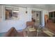 Enclosed patio featuring a glass table and seating, with views into the home at 2113 Barksdale St, Port Charlotte, FL 33948