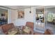 Enclosed patio featuring a glass table and seating with views into the home at 2113 Barksdale St, Port Charlotte, FL 33948
