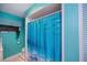 Stylish blue shower curtain in a well-lit bathroom at 2113 Barksdale St, Port Charlotte, FL 33948