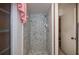 Modern shower stall with textured tiles and a contemporary shower head at 2113 Barksdale St, Port Charlotte, FL 33948