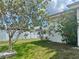 A picturesque outdoor view of a well kept backyard showing both trees and shrubbery at 2321 Dallas St, Port Charlotte, FL 33952