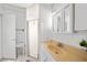 Compact bathroom featuring a tiled shower, a sink with updated fixtures and neutral paint at 2321 Dallas St, Port Charlotte, FL 33952