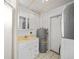 Functional laundry room featuring a utility sink and updated washer/dryer at 2321 Dallas St, Port Charlotte, FL 33952