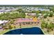 Beautiful aerial view of the condo complex, showcasing the landscaping, nearby pond, and well-maintained grounds at 23465 Harborview Rd # 1002, Punta Gorda, FL 33980