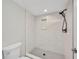 Sleek bathroom with modern, tiled walk-in shower with rainfall shower head at 23465 Harborview Rd # 1002, Punta Gorda, FL 33980