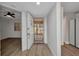 Bright foyer with wood-look tile, leading into the living spaces, with a view to the entry door at 23465 Harborview Rd # 1002, Punta Gorda, FL 33980