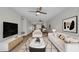 Cozy living room features stylish decor, comfortable seating, with view to the dining area and kitchen at 23465 Harborview Rd # 1002, Punta Gorda, FL 33980