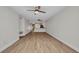 Living room with hardwood floors, neutral paint and open to the kitchen with a bar at 23465 Harborview Rd # 1002, Punta Gorda, FL 33980