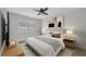 Comfortable main bedroom with modern decor, neutral color palette, and bright window at 23465 Harborview Rd # 1002, Punta Gorda, FL 33980