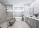Modern bathroom with soaking tub, glass shower, dual sink vanity and stylish fixtures at 25273 Paraguay St, Punta Gorda, FL 33983