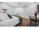 Cozy bedroom featuring a neutral color scheme, ceiling fan, and minimalist decor at 25273 Paraguay St, Punta Gorda, FL 33983