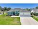 Charming single-story home with a well-manicured lawn and a two-car garage, creating excellent curb appeal at 25273 Paraguay St, Punta Gorda, FL 33983