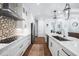 Spacious modern kitchen with stainless steel appliances and white cabinetry at 25273 Paraguay St, Punta Gorda, FL 33983