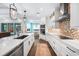 Well-lit kitchen with stainless steel appliances and island with breakfast bar at 25273 Paraguay St, Punta Gorda, FL 33983