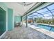 Covered lanai with outdoor furniture and ceiling fans overlooking the pool at 25273 Paraguay St, Punta Gorda, FL 33983