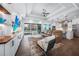 Comfortable living room with a view of the backyard pool through sliding glass doors at 25273 Paraguay St, Punta Gorda, FL 33983