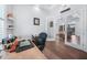 Bright office with wood floors and glass doors leading to an outdoor pool at 25273 Paraguay St, Punta Gorda, FL 33983