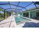 Inviting screened-in pool area with ample seating and tropical landscaping at 25273 Paraguay St, Punta Gorda, FL 33983