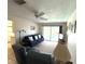 Cozy living room with comfortable seating and view to the pool at 261 Caddy Rd, Rotonda West, FL 33947