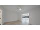 Bright bedroom with neutral walls, tile floors, and ceiling fan with light at 27385 Voyageur Dr, Punta Gorda, FL 33983