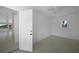 Bright bedroom featuring tiled floors, white walls and trim, and a ceiling fan at 27385 Voyageur Dr, Punta Gorda, FL 33983