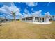 Single story home with a spacious yard, new patio, and canal in the backyard at 27385 Voyageur Dr, Punta Gorda, FL 33983