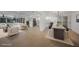 Bright, open-concept living and dining area with modern lighting and neutral color palette at 27385 Voyageur Dr, Punta Gorda, FL 33983