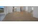 Open concept living area with lots of natural light and tile flooring at 27385 Voyageur Dr, Punta Gorda, FL 33983