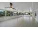 Bright sunroom featuring tiled floors, white walls, and canal views at 27385 Voyageur Dr, Punta Gorda, FL 33983
