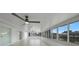 Bright sunroom featuring tiled floors, white walls, and canal views at 27385 Voyageur Dr, Punta Gorda, FL 33983