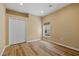 Clean bedroom features wood floors, a double closet, a window and base molding at 2871 Suncoast Lakes Blvd, Punta Gorda, FL 33980