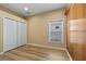 Bedroom with wood floors, a closet, and a window at 2871 Suncoast Lakes Blvd, Punta Gorda, FL 33980