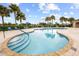 Sparkling community pool with plenty of lounge chairs and umbrellas for a relaxing experience at 2871 Suncoast Lakes Blvd, Punta Gorda, FL 33980