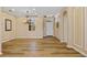 Inviting entryway with hardwood floors and decorative accents, chandelier, and wainscoting at 2871 Suncoast Lakes Blvd, Punta Gorda, FL 33980