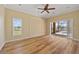 Living area with wood flooring, backyard access, and a decorative inset wall at 2871 Suncoast Lakes Blvd, Punta Gorda, FL 33980