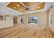 Open living area featuring wood floors and sliders to backyard with water view at 2871 Suncoast Lakes Blvd, Punta Gorda, FL 33980