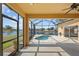 Covered patio featuring a plunge pool, ceiling fan, and view of the lake at 2871 Suncoast Lakes Blvd, Punta Gorda, FL 33980