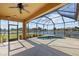 A view of the covered, screened-in patio with plunge pool and water view at 2871 Suncoast Lakes Blvd, Punta Gorda, FL 33980
