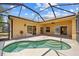 Relaxing screened-in lanai with a beautiful, in-ground spa with inviting clear water at 2871 Suncoast Lakes Blvd, Punta Gorda, FL 33980