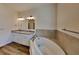 A luxurious soaking tub and granite-topped double vanity stand out in this modern bathroom at 298 Overbrook St, Port Charlotte, FL 33954