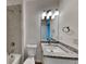 A new bathroom with a granite counter, bathtub, and shower combo at 298 Overbrook St, Port Charlotte, FL 33954